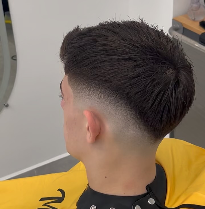 Crisp taper fade from the back at ELEMENT Barbershop